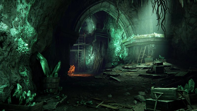 A cavern lit with pale green light, with a pointed arch holding up the roof. The floor is littered with mining implements and boxes and barrels full of mined crystal. An orange glow comes from the torch of a single miner, crouched beside the arch.