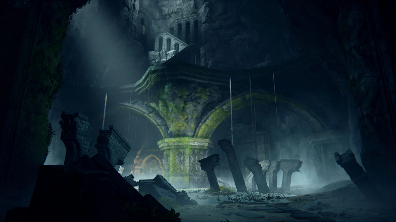 A tall cavern, filled with ruined architecture: large moss-strewn arches, broken fragments of a small aqueduct, and high above, the zigzag pattern of the surviving aqueduct. Water rains down, forming a shallow lake beneath a pale shaft of light.