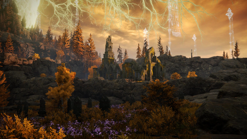A ruined church, lit by golden sunset, amongst small cliffs of grey stone. In the foreground, a shock of purple flowers decorates a cluster of gravestones, and above, the shining branches of the Erdtree reach down like fingers.