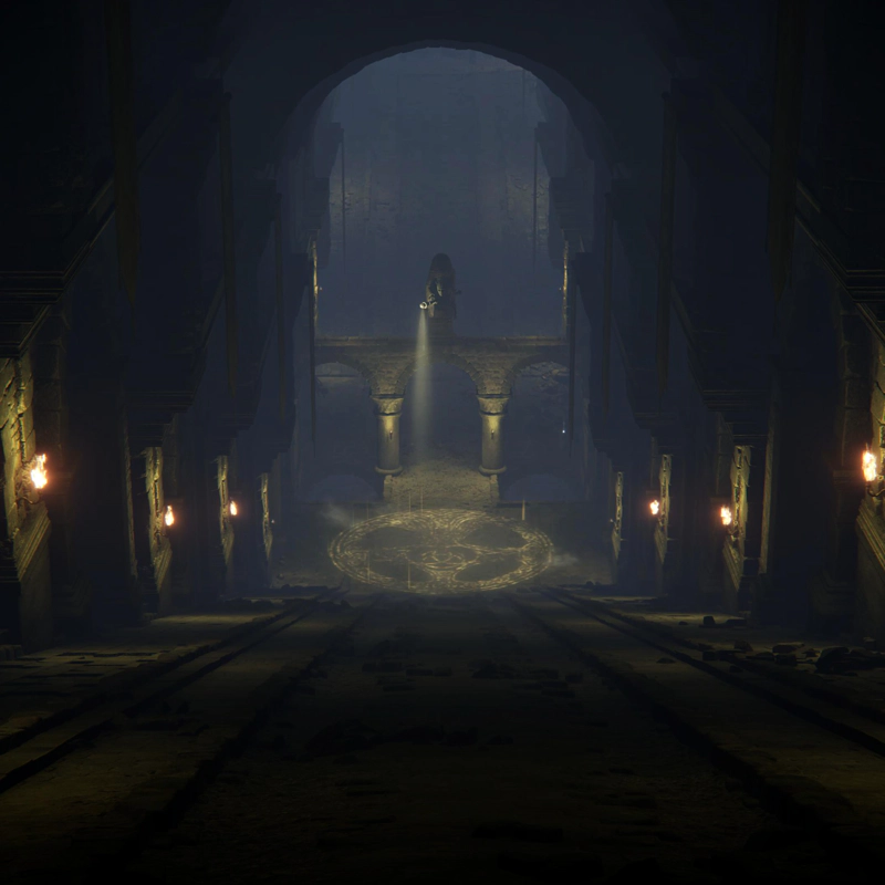 A dimly-lit slope in a hero's grave. Torches lead the eye to a statue shining a light at the floor, where it inscribes an Erdtree symbol.