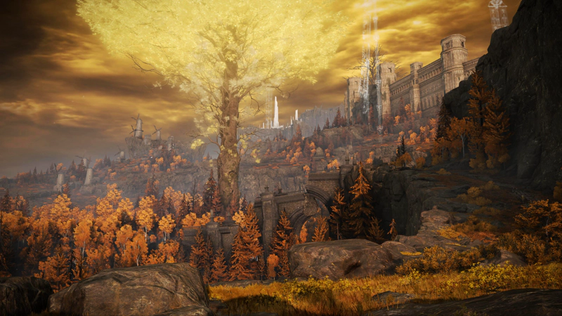 An expansive view across the Altus Plateau, past a minor Erdtree and a shattered stone causeway, to overlapping layers of tree-strewn cliffsides. In the distance, the windmill village can be seen to the left, and the Capital walls lead to the right, towards distant spears of ice.