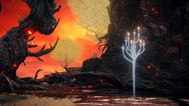 A spectral white candelabra stands in a swamp, against a backdrop of dark, twisted trees, dirty red-brown swamp water and grey cliffs. Beyond, a pair of golden erdtrees stand tall against a firey-orange sky.