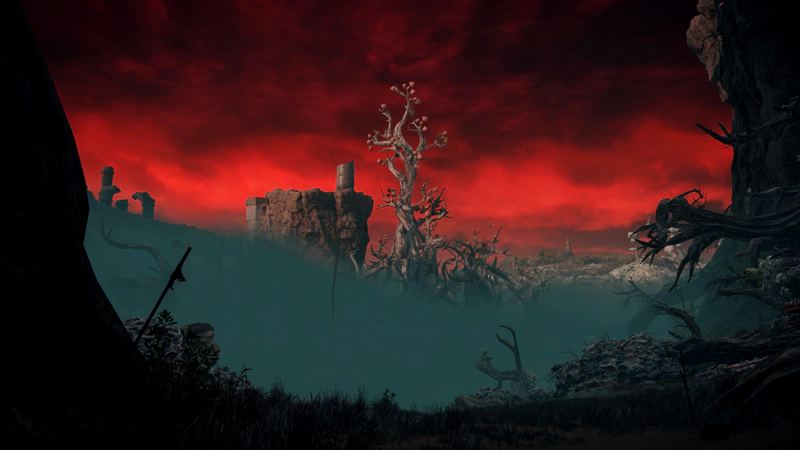 A view from a shaded valley of dead trees and uneven stones, across a heavy grey fog towards a large twisted tree spearing the red sky. Ruins can be seen on the skyline.