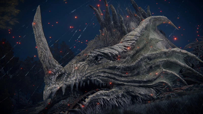 The head of an ancient dragon, asleep on a grassy slope. It has a single large horn protruding from its nose, and its mouth lolls open. The sky is navy blue and full of embers.