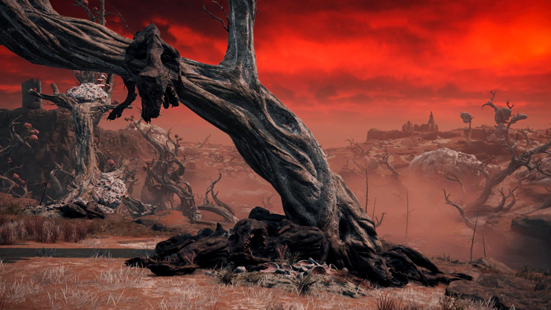 A twisted grey-pink tree arching over a path, surrounded by the corpses of monstrous dogs. The sky is clouded in angry scarlet, and pink mist rises from the swamp in the distance.