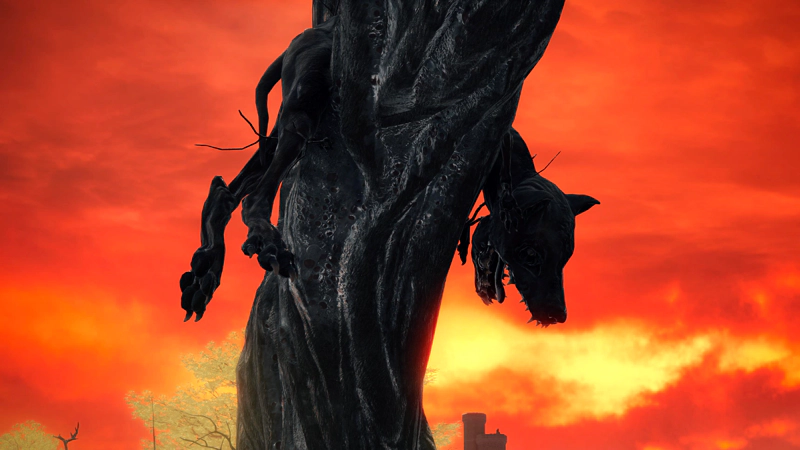 The corpse of a monstrous dog, dangling from the upper reaches of a tree trunk. The dark wood bisects the image, with the dog's hind legs to the left and its jaws gaping open to the right. The sky beyond is bright shades of variegated orange, silhouetting the horror.