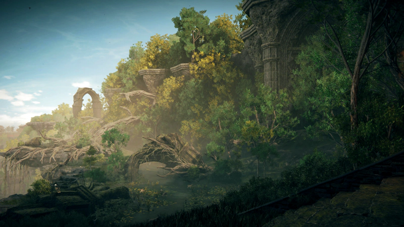 A verdant forest flourishes around a cliffside river, curving into the distance.To the left the cliff drops away beneath exposed tree-roots, and to the right, ancient ruined columns and arches emerge from the foliage.