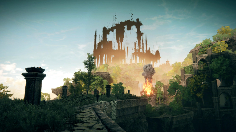 A precipitous stone causeway, overgrown with grass and shrubs, leading across to a dense cluster of ruins and trees guarded by a golem of cast iron and fire. The golem has lowered its head, and a cloud of dark grey smoke billows into the air. The sky above is a pale cyan with wispy clouds, and in the distance a city of shadowed spirals rises above the grey cliffs.
