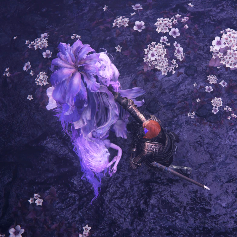 A view from above, as Gille kneels with a flower in her hair, reaching out to Saint Trina's discarded purple robes. Trina herself lies on the cold ground below, her arms folded beneath her head in a resemblance of the slumber she personifies.