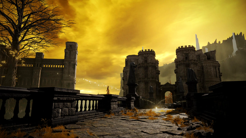 A causeway towards a large stone gatehouse, beneath dark yellow clouded skies. A shard of grace hovers above cracked paving stones and low-lying golden foliage.