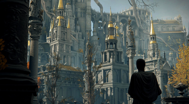A robed statue gazes upwards, silhouetted, at the processional statues and layers of architecture winding up towards the heart of the Capital.