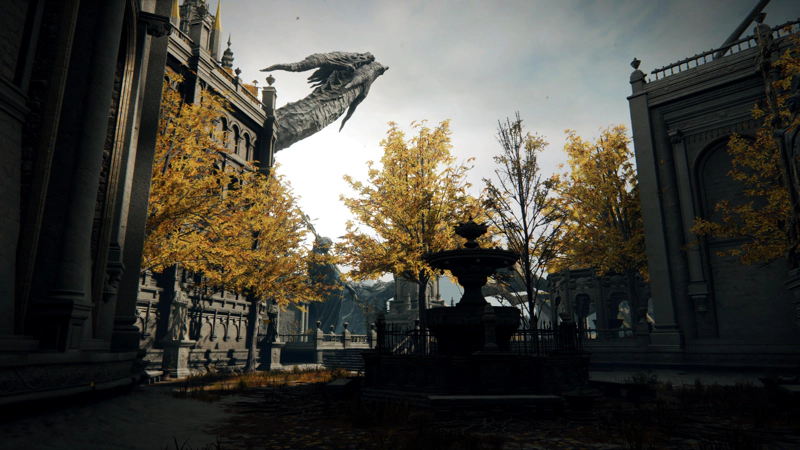 A dimly-lit courtyard with a central fountain. A row of trees beyond stand golden in the sunlight, and the stone dragon's head rises into the sky.