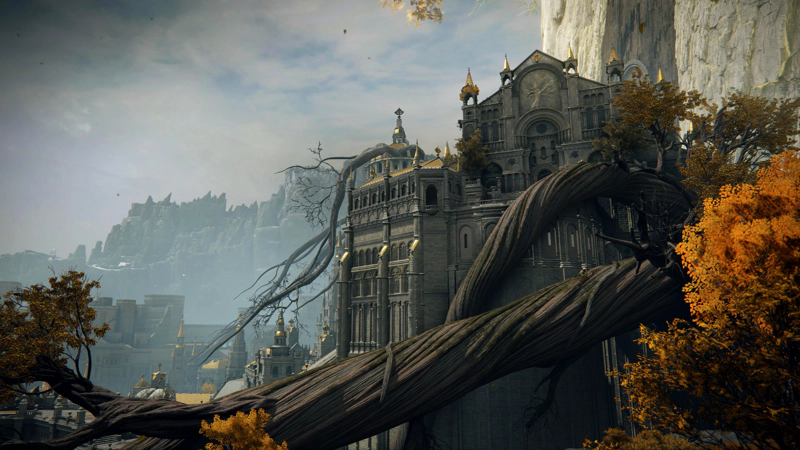 A massive tree root winds through the air, from the floor of the Capital towards a grand cathedral, decorated with an Erdtree motif. There are profusions of variegated orange foliage along its length.