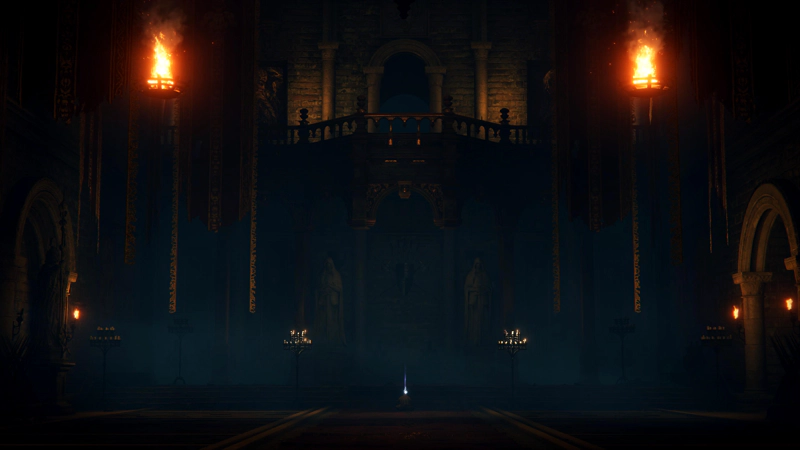 The flame-lit grand hall of a darkened manor. A high balcony overlooks a pair of chandeliers and accompanying statues. A small purplish wisp rises from the centre of the floor.