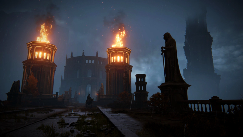 A bridge to a large circular tower, at night. Robed statues stand silhouetted against vast flaming braziers; below, mounted knights patrol the way forward.