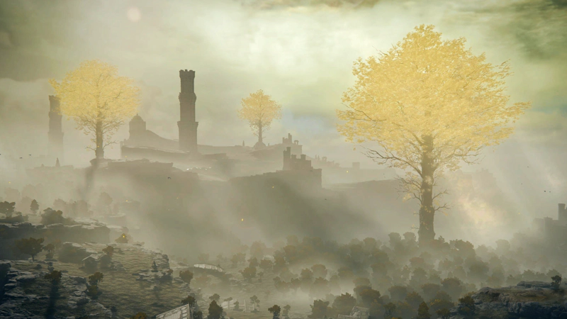 A hazy view across a golden landscape, towards a trio of distant golden trees and tall stone towers. Below, the landscape is speckled with stone ruins and yellow-brown treetops.