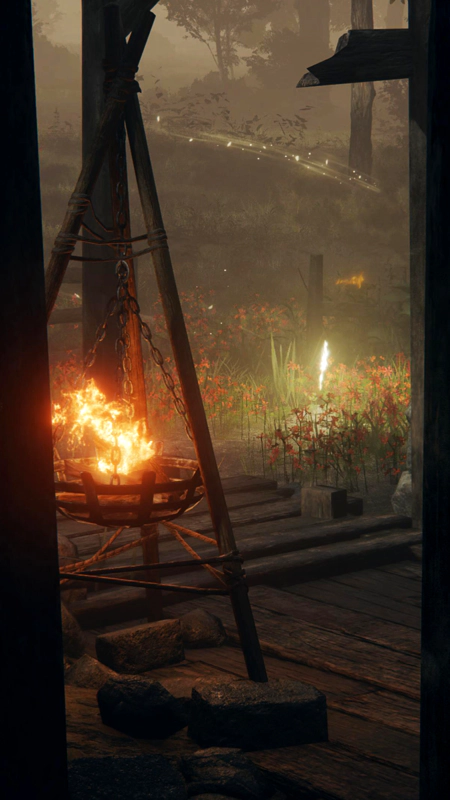 A close-up of a burning brazier at dusk, and the grace beyond. An arc of light leads the eye down towards the light sources.