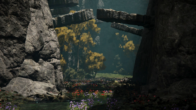 A pass between grey stone cliffs, beneath jutting gravestones. Coloured flowers grow from the water below, and the trees beyond are rich and golden.