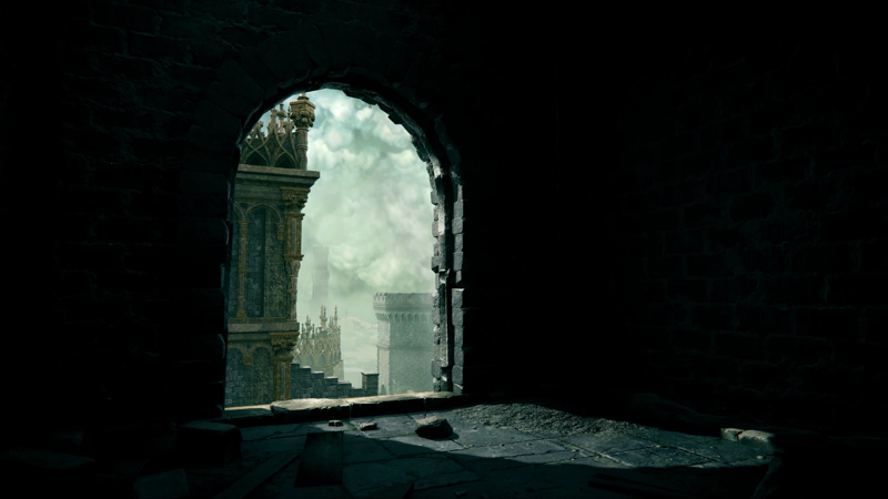 A stone archway in the castle. Daylight shines through, casting an arch-shape against the grey paving slabs inside, and the castle towers can be seen beyond.