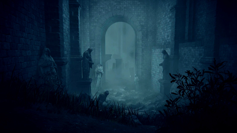 A broken-down channel in the bowels of a castle, drenched in blue. A grassy slope leads past broken statues, towards a large stone archway.