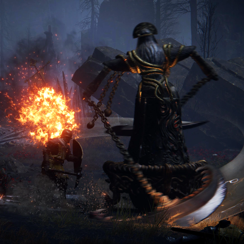 A large metal automaton, styled to look like a woman in a robe, swings its scythe arms in a blurred arc towards a soldier in yellow armour, holding up a metal shield to brace himself. They're both standing in shallow water, and beyond, something's exploded in a burst of bright flame.