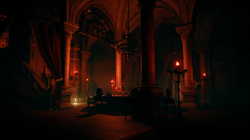 The reception chamber of a lavish manor house, dimly lit with red torches on elaborate candelabra. In the centre of the room a circular table has been laid for a meal, and to the left a grand staircase leads up into the hall above.
