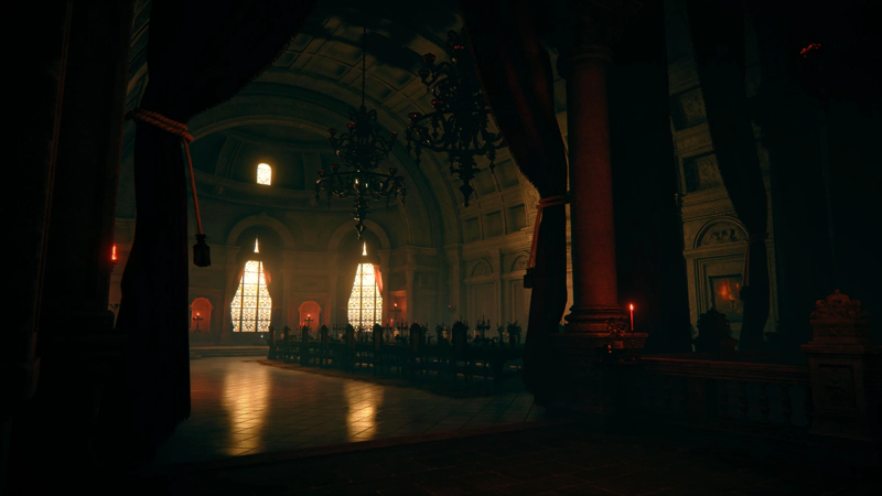 A grand banqueting hall, lit by red candles and the red-gold sunset beyond the large arched windows at the far end. The sunlight reflects off the polished floor, beneath a long rectangular banqueting table. Large, grotesquely-ornate chandeliers dangle from a vaulted ceiling high above.