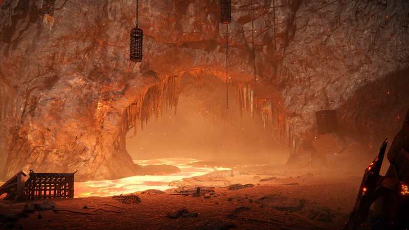 A river of lava running through an underground cavern, scattered with broken cages and lit with gleaming fire. A natural stone archway is jagged with stalactites.