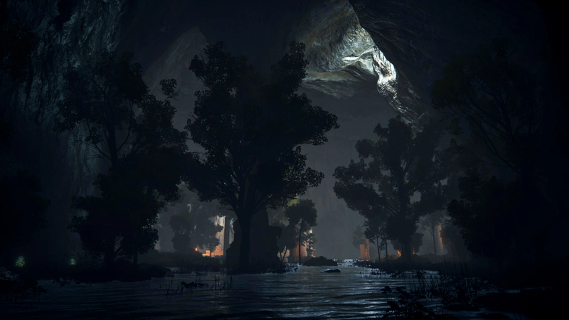 An underground river, lit by a shaft of pale sunlight from a crack in the rocks above. In the distance, firelit ruins are obscured by the foliage of a number of trees.