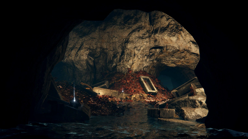 A bright underground chamber filled with squared-off stone coffins scattered atop piles of red-bone skeletons. A river runs through the chamber, lapped at the bonepiles.