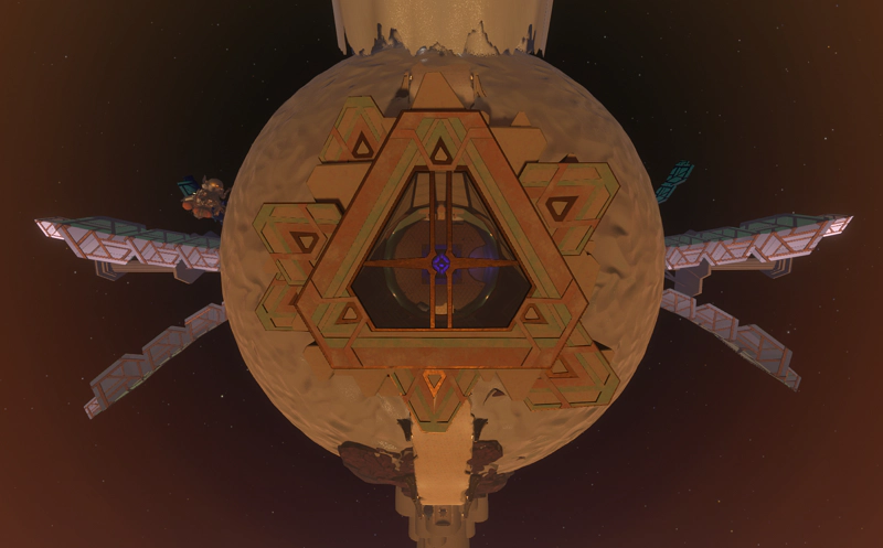 A triangular tower on the sandy planet, from above. The roof is transparent glass, and a blue glow can be seen through a lens in the centre. Two large solar arrays emerge from the poles of the planet.