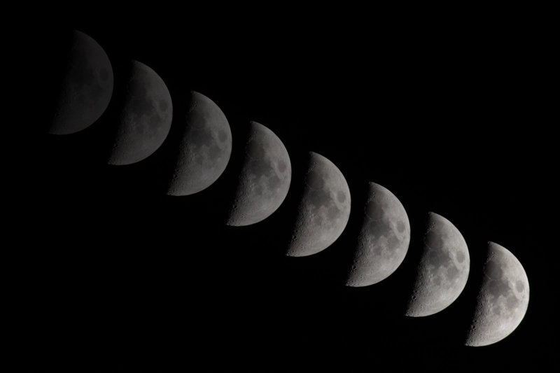 A composite of a half moon moving across the camera lens from top-left to bottom right, photos taken 90 seconds apart. The earlier images are semi-transparent, echoes of where the moon had been previously.